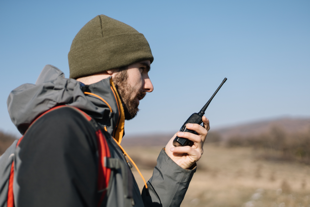 two-way radio with long range being held by a man outdoors