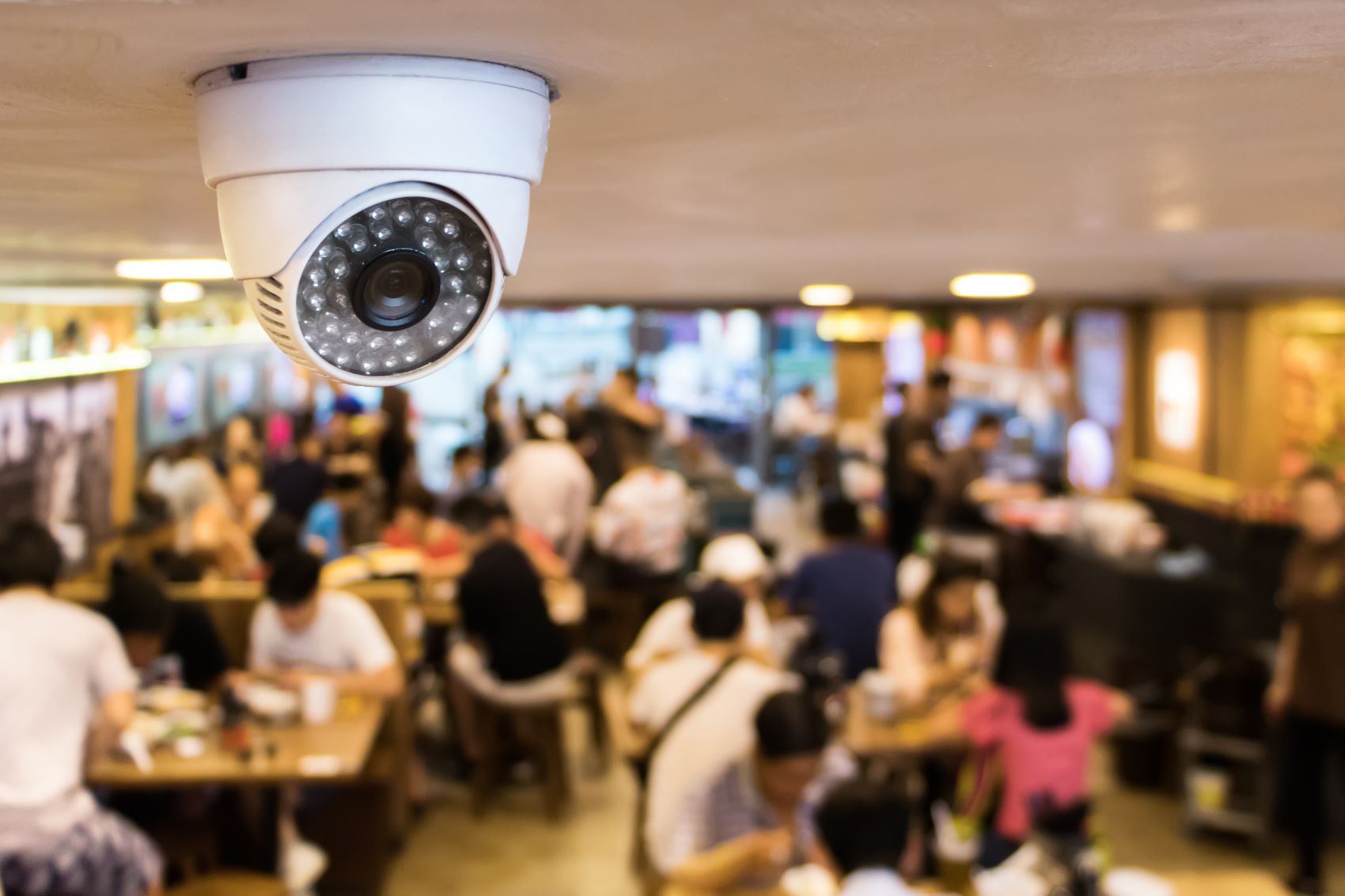 security camera installed on the ceiling of a restaurant 