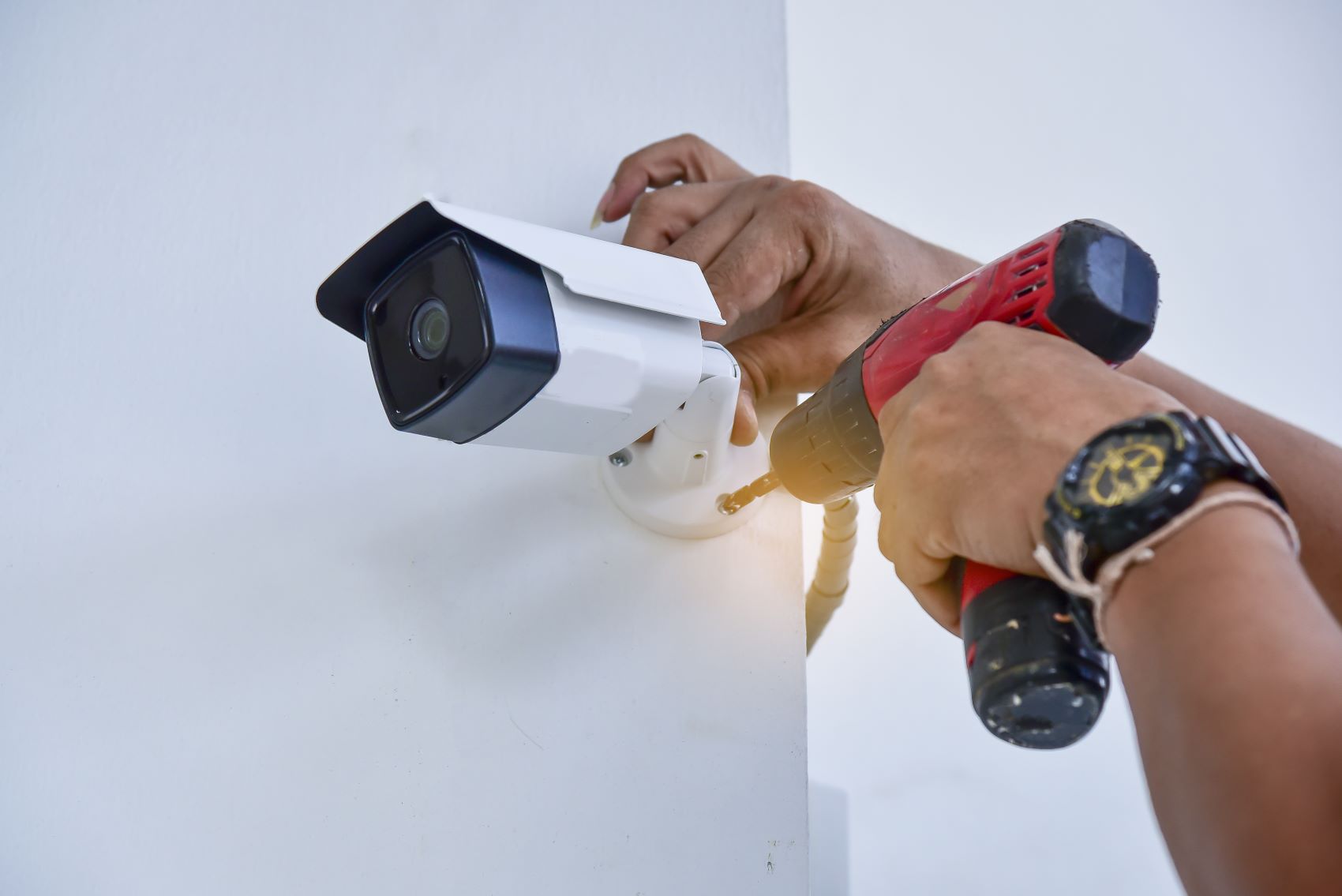 technician installing security camera for philadelphia business 